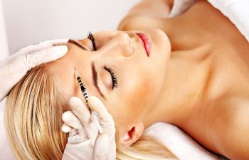 Beauty woman getting botox cosmetic injections.