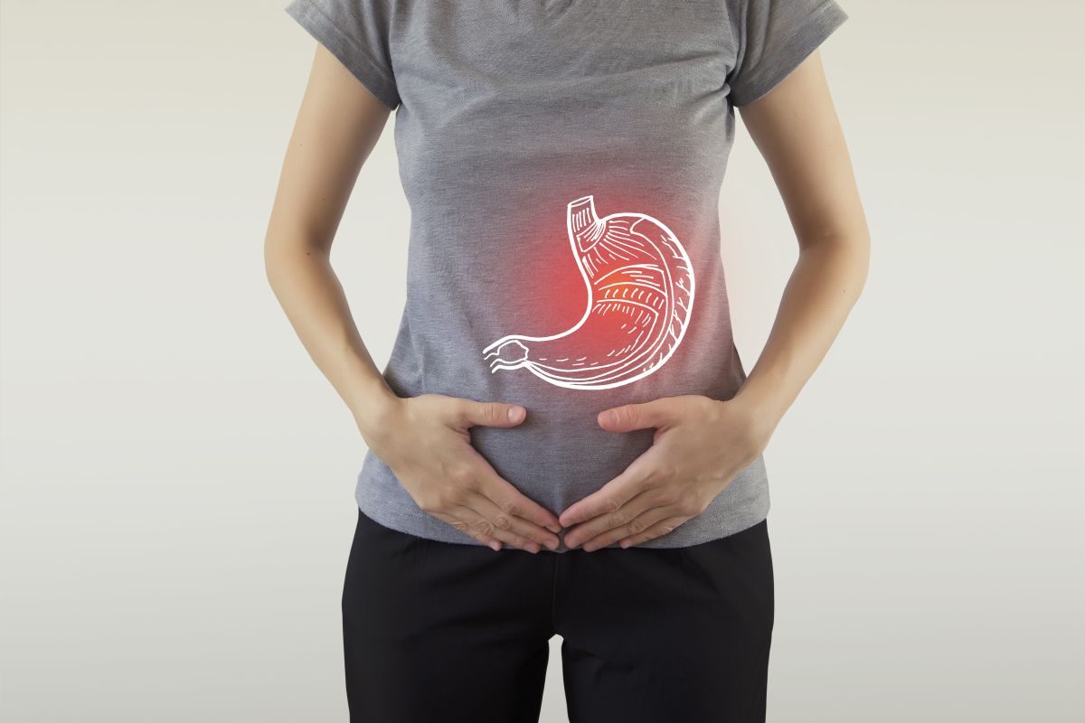 Digital Composite Of Highlighted Stomach Of Woman / Health Care