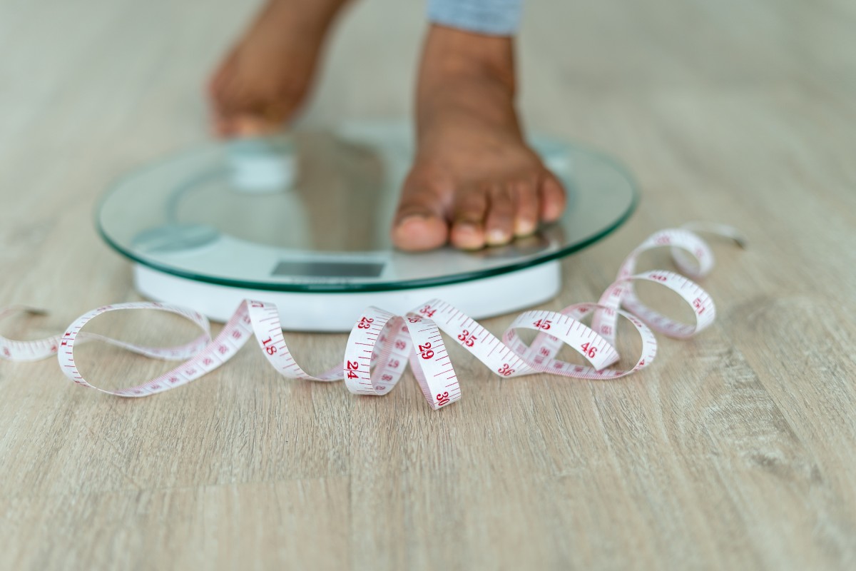 woman stand on scales