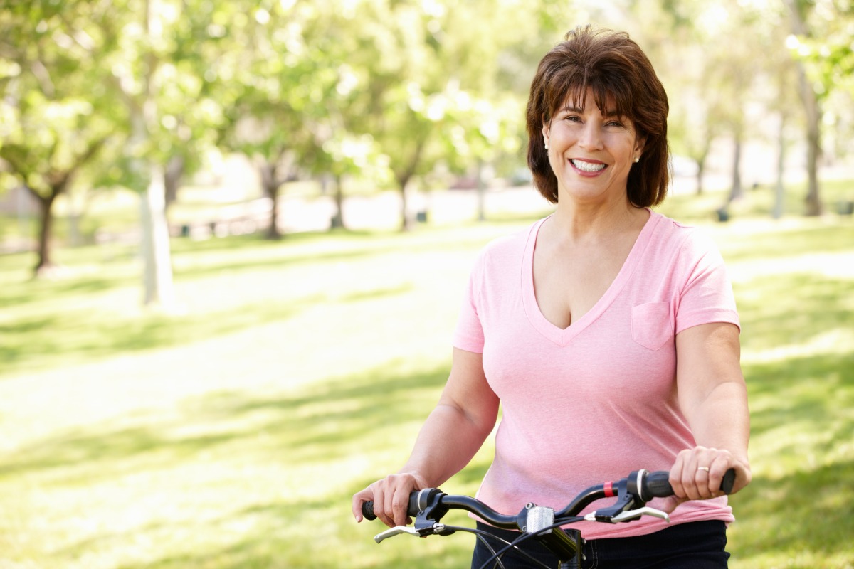 happy woman with bike