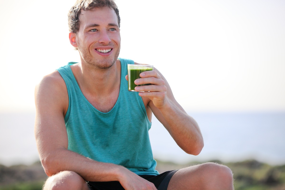 man drinking vegetable juice