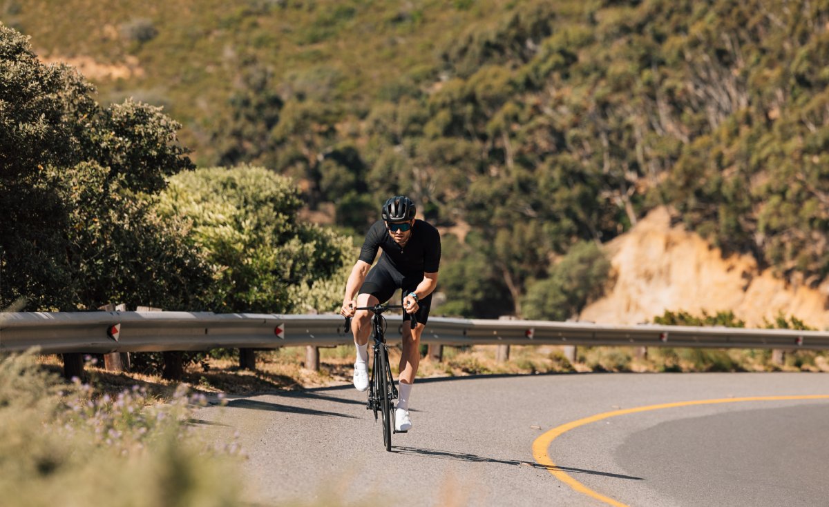 cyclist doing an intense ride on an empty mountain road